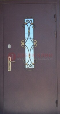 Металлическая дверь со стеклом и ковкой ДСК-77 в панельный дом в Кингисеппе